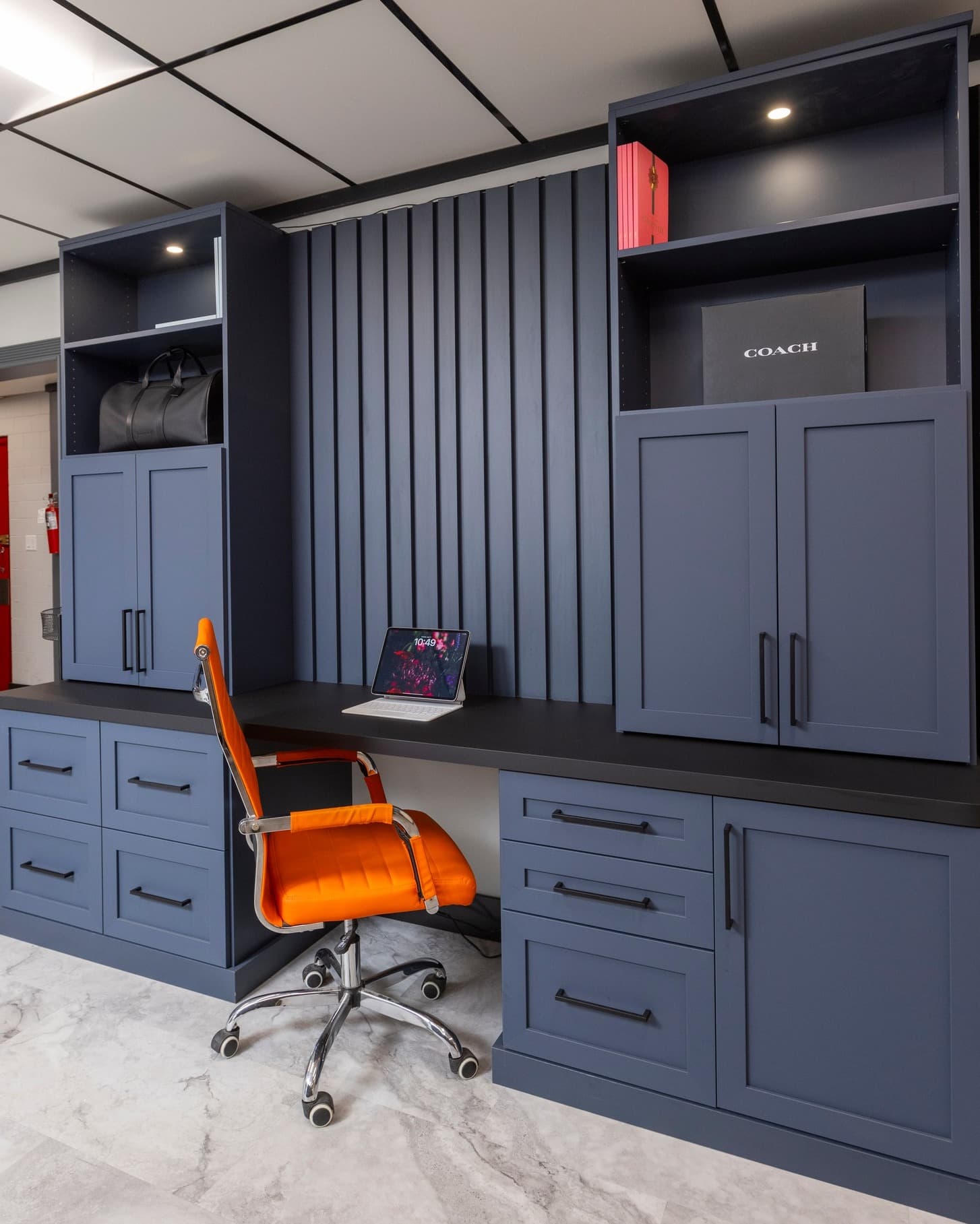 Custom home office with quartz countertop and built-in cabinetry