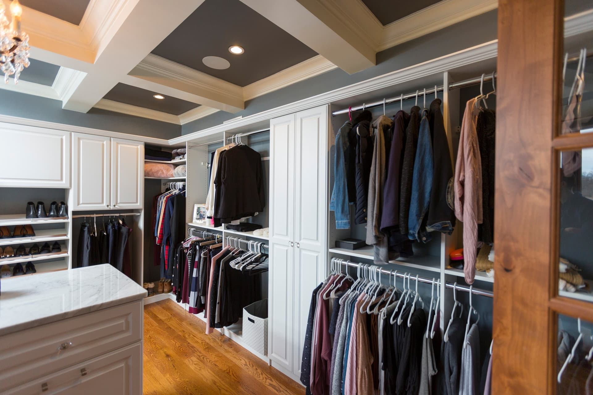 Custom closet shoe storage with chandelier