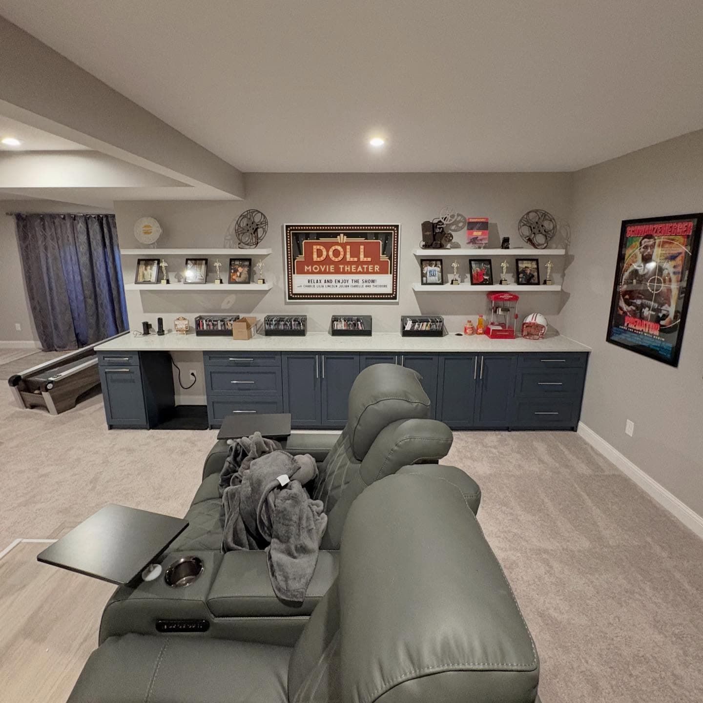 Navy blue entertainment center with home theater setup