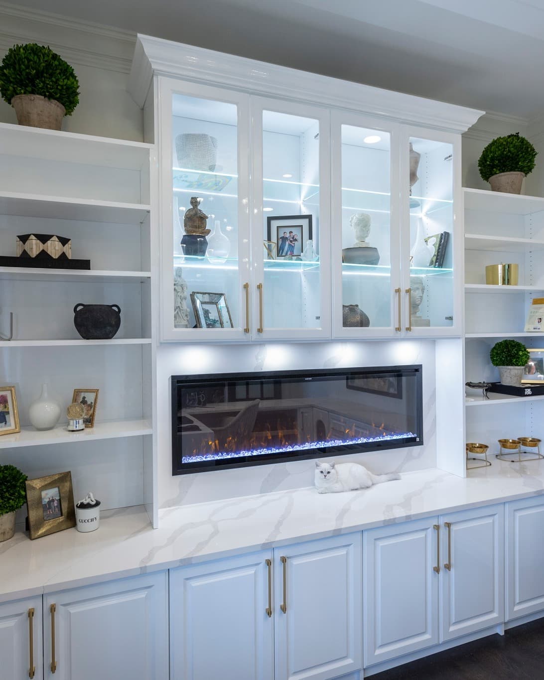 White built-in entertainment system with quartz countertop