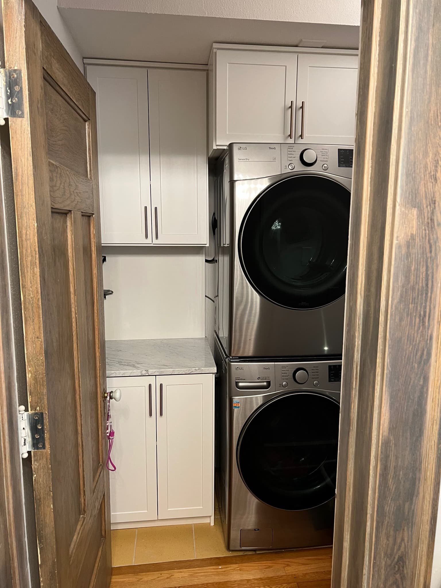 White laundry room storage system