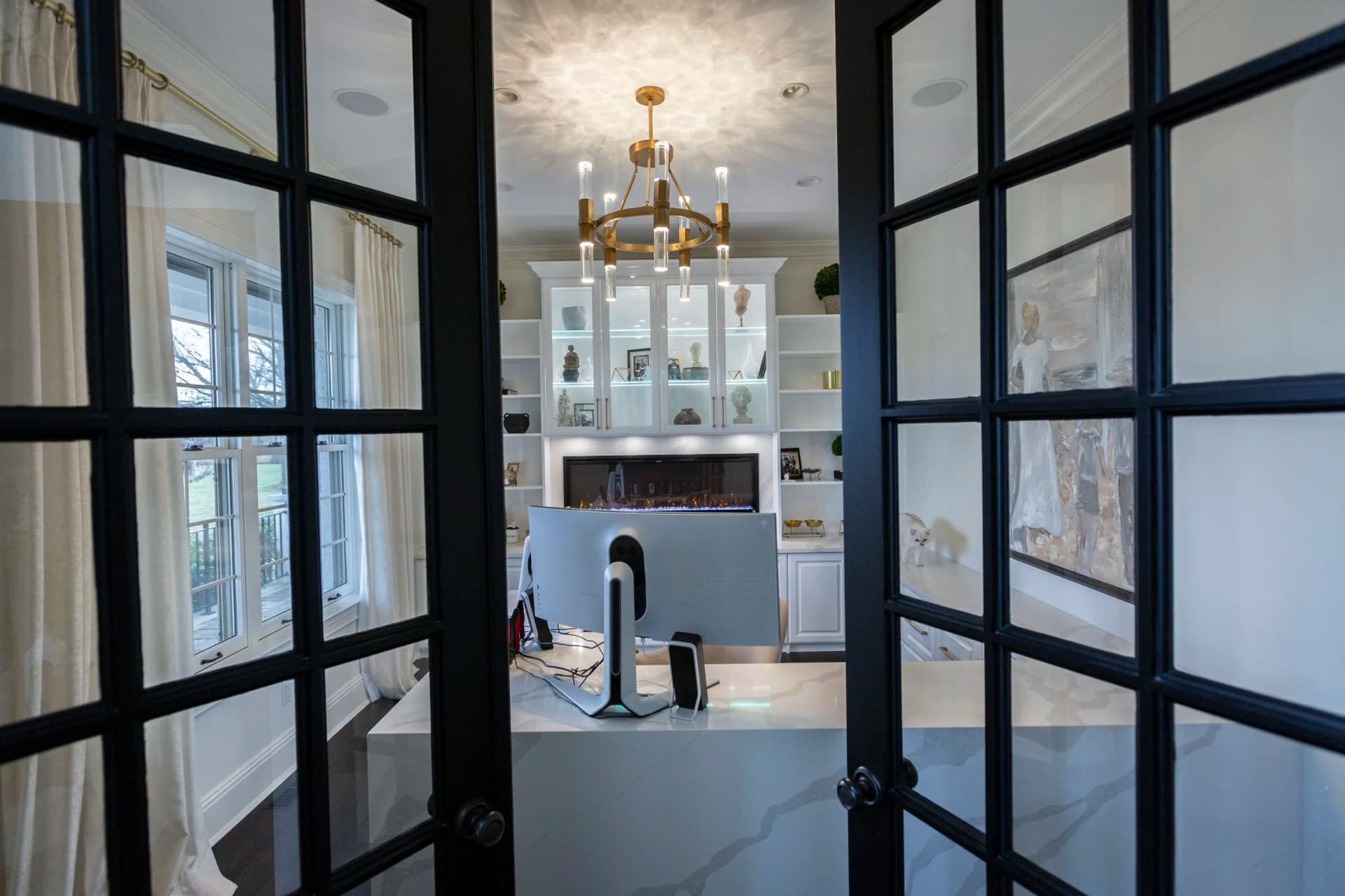 Custom home office with quartz countertop and built-in cabinetry