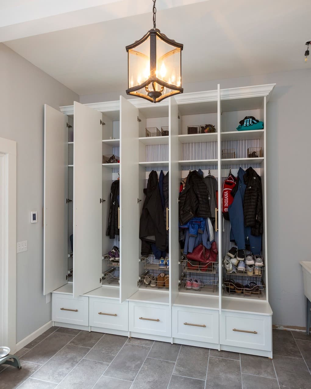 White custom mudroom with built-in storage